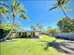 Well-kept beach house at end of Puako with large surrounding yard